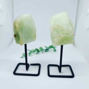 Raw Green Calcite Crystal on a stand